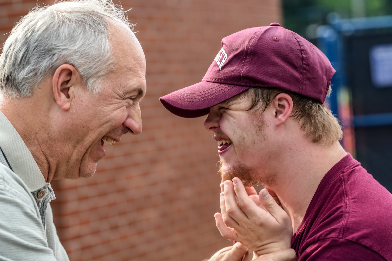 A caregiver laughing with a client