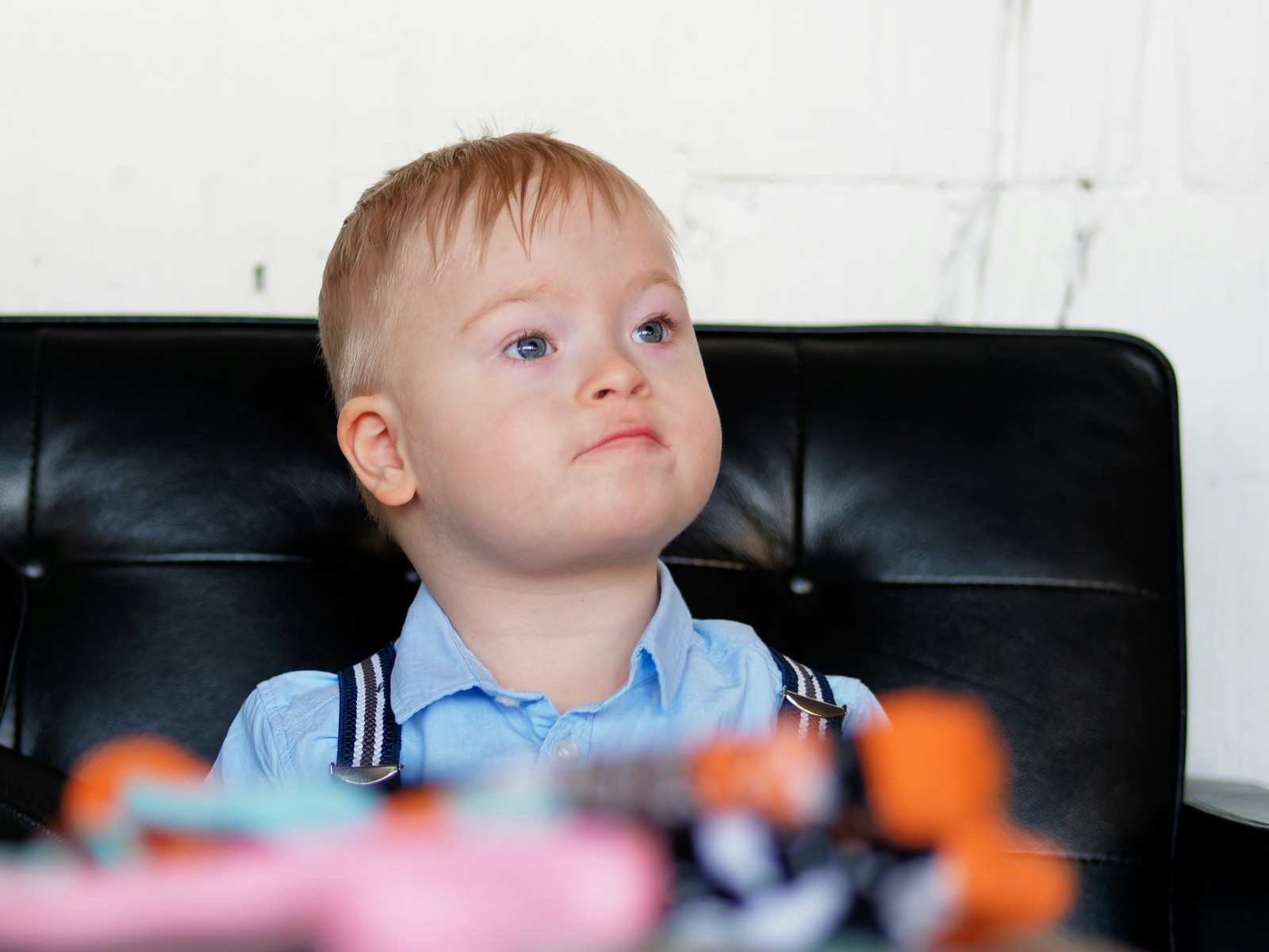 A child sitting on a sofa